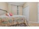 This bedroom features a quaint headboard and a patterned quilt on the bed at 2731 Cypress Tree Trl, St Cloud, FL 34772