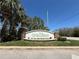 Elegant Cypress Preserve community entrance sign with lush landscaping and stone accents at 2731 Cypress Tree Trl, St Cloud, FL 34772