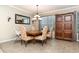 Dining room with natural light from the window and stylish light fixture at 2731 Cypress Tree Trl, St Cloud, FL 34772