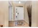 Bright foyer featuring tile flooring with decorative mosaic, white door with sidelight and modern door lock at 2731 Cypress Tree Trl, St Cloud, FL 34772