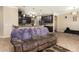 Open kitchen with dark wood cabinets and a bar-style counter seating area at 2731 Cypress Tree Trl, St Cloud, FL 34772