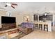Cozy living room with an open floor plan, tiled floors, neutral paint, and ceiling fan at 2731 Cypress Tree Trl, St Cloud, FL 34772