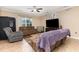 Comfortable living room features neutral tones, ceiling fan, and natural light at 2731 Cypress Tree Trl, St Cloud, FL 34772
