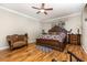 Spacious main bedroom featuring elegant furnishings and a ceiling fan for comfort at 2731 Cypress Tree Trl, St Cloud, FL 34772