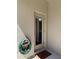 Beige patio door leads to bathroom with welcome mat and coiled garden hose at 2731 Cypress Tree Trl, St Cloud, FL 34772