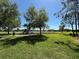 Community playground with play equipment and ample open space, perfect for outdoor activities at 2731 Cypress Tree Trl, St Cloud, FL 34772