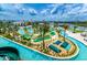 An aerial shot of a fun community waterpark with lazy river, slides, mini golf, and inviting sun loungers at 2775 Bookmark Dr, Kissimmee, FL 34746