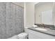Cozy bathroom featuring a shower-tub combination and a vanity with a sink at 2775 Bookmark Dr, Kissimmee, FL 34746