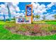 A beautifully landscaped entrance sign welcomes you to Storey Lake, a vibrant residential community at 2775 Bookmark Dr, Kissimmee, FL 34746