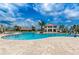 Large community pool, palm trees, and lounge seating at Storey Lake Resort in Kissimmee, Florida at 2775 Bookmark Dr, Kissimmee, FL 34746