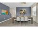 The dining area features contemporary lighting, table with seating for eight, and stylish decor at 2775 Bookmark Dr, Kissimmee, FL 34746