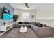 Comfortable living room with a large sectional sofa and a flat-screen television at 2775 Bookmark Dr, Kissimmee, FL 34746