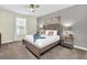 Cozy main bedroom featuring a comfortable queen-sized bed and neutral decor at 2775 Bookmark Dr, Kissimmee, FL 34746