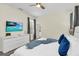 Beautiful main bedroom featuring a comfortable king-sized bed, a television, and neutral decor at 2775 Bookmark Dr, Kissimmee, FL 34746