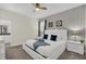 Relaxing main bedroom featuring a comfortable king-sized bed, ensuite bathroom, and modern decor at 2775 Bookmark Dr, Kissimmee, FL 34746