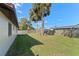 Large backyard showing a lush lawn and fenced perimeter, providing ample space for relaxation and recreation at 2955 Foxcroft Ln, South Daytona, FL 32119