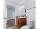 Bright bathroom featuring granite countertop, wood cabinets at 2955 Foxcroft Ln, South Daytona, FL 32119