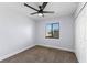 Bedroom with neutral carpet, ceiling fan, window and a double door closet at 2955 Foxcroft Ln, South Daytona, FL 32119