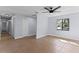 Bright bedroom with tile flooring, a modern ceiling fan, and a large window with natural light at 2955 Foxcroft Ln, South Daytona, FL 32119