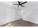 Bedroom with neutral carpet, ceiling fan and a double door closet at 2955 Foxcroft Ln, South Daytona, FL 32119