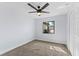 Bedroom with neutral carpet, ceiling fan and a window providing natural light at 2955 Foxcroft Ln, South Daytona, FL 32119