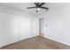 Bedroom with neutral carpet, ceiling fan, doorway and a double door closet at 2955 Foxcroft Ln, South Daytona, FL 32119