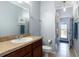 Well-maintained bathroom with a shower and views of the fenced-in backyard at 2956 Falconhill Dr, Apopka, FL 32712