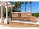 Entrance sign of the Wekiva Springs Estates community surrounded by palm trees and landscaping at 2956 Falconhill Dr, Apopka, FL 32712