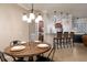 Open dining area with access to kitchen and view of living spaces at 2956 Falconhill Dr, Apopka, FL 32712