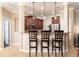 Kitchen bar includes granite countertop, bar stool seating, and pendant lighting at 2956 Falconhill Dr, Apopka, FL 32712