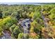 Panoramic aerial view of home surrounded by lush trees and natural surroundings, creating a serene atmosphere at 322 Harbor Trl, Enterprise, FL 32725