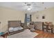 A Bedroom showcasing a crib, changing table, comfortable chair and soft decor elements at 322 Harbor Trl, Enterprise, FL 32725