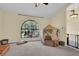Bedroom featuring a large window, neutral carpet, and a built-in baby gate at 322 Harbor Trl, Enterprise, FL 32725