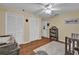 This bedroom features hardwood floors, bright colors and ample closet space and a rug at 322 Harbor Trl, Enterprise, FL 32725