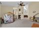 Spacious living room showcasing a fireplace, high ceilings, and an abundance of natural light at 322 Harbor Trl, Enterprise, FL 32725