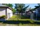 Fenced backyard with potential for gardening or play, featuring a secure perimeter for privacy and safety at 345 W Seminole Ave, Eustis, FL 32726