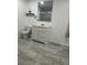 Bathroom features a toilet, sink, vanity and shower at 345 W Seminole Ave, Eustis, FL 32726