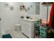 Cozy bathroom featuring a white vanity, modern fixtures, and tiled floors, offering a clean and functional space at 345 W Seminole Ave, Eustis, FL 32726