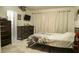 Comfortable bedroom features a floral comforter and neutral-toned walls at 345 W Seminole Ave, Eustis, FL 32726