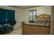 Bedroom with wood-look flooring and a bed with plaid bedding at 345 W Seminole Ave, Eustis, FL 32726