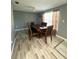 Dining room area with wooden furniture set and a window to let light in at 345 W Seminole Ave, Eustis, FL 32726