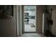 Kitchen view from hallway featuring white cabinets and backsplash at 345 W Seminole Ave, Eustis, FL 32726