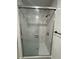 Shower stall features white, marble-look tiling and modern fixtures at 345 W Seminole Ave, Eustis, FL 32726