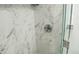 Shower with marble tile and glass door at 345 W Seminole Ave, Eustis, FL 32726