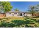 Spacious backyard features lush green lawn and a privacy fence at 3706 Wade Rd, Orlando, FL 32808