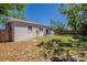 Spacious backyard features lush green lawn and a privacy fence at 3706 Wade Rd, Orlando, FL 32808