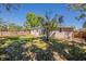 Spacious backyard features a sliding glass door, fence, and lush green lawn at 3706 Wade Rd, Orlando, FL 32808