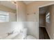 Bright bathroom with a sink, vanity, and toilet at 3706 Wade Rd, Orlando, FL 32808