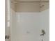 Bathroom shower and tub with a white tiled wall at 3706 Wade Rd, Orlando, FL 32808