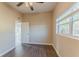 Comfortable bedroom with vinyl wood floors and natural light at 3706 Wade Rd, Orlando, FL 32808